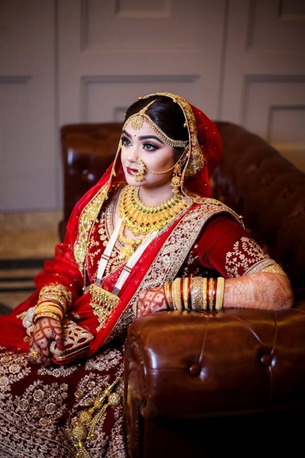 Woman in Red Sari Dress Siting on Sofa